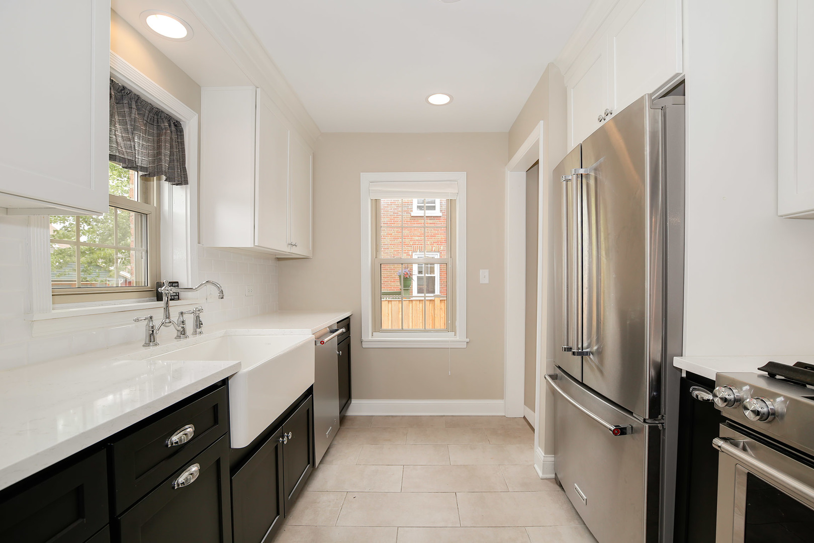 852 Spring Road Elmhurst, IL 60126 - Photo 7 of 24 a kitchen with a sink and a refrigerator