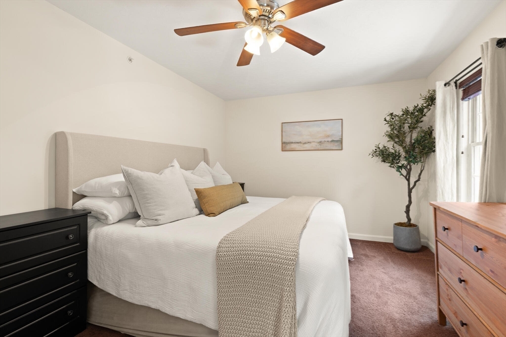 41 Boston Road, Unit 485 Billerica, MA 01862 - Photo 11 of 19 a bed room with a bed and a window