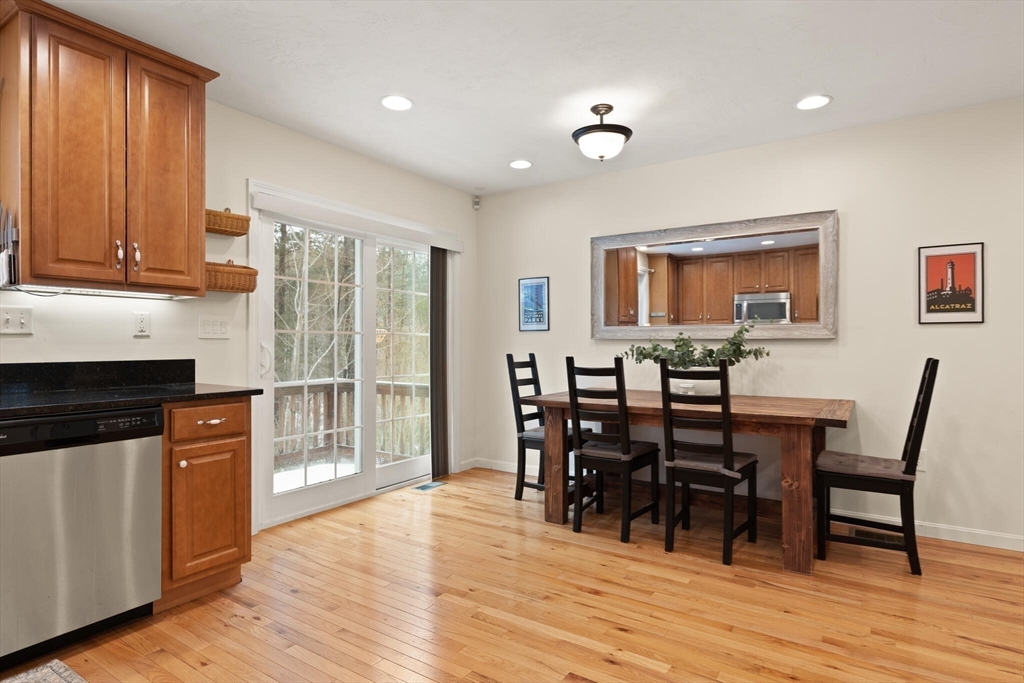 41 Boston Road, Unit 485 Billerica, MA 01862 - Photo 3 of 19 a view of a dining room with furniture and wooden floor