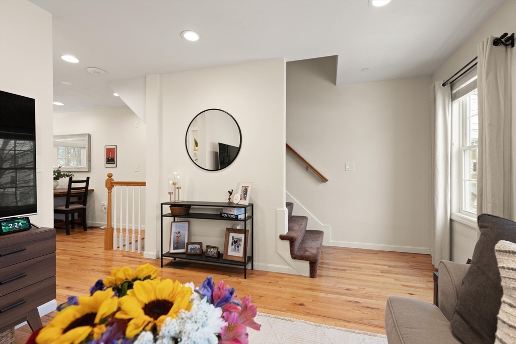 41 Boston Road, Unit 485 Billerica, MA 01862 - Photo 8 of 19 a living room with furniture a fireplace and a large window