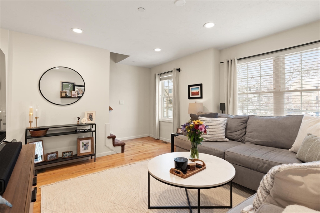41 Boston Road, Unit 485 Billerica, MA 01862 - Photo 9 of 19 a living room with furniture a fireplace and a large window