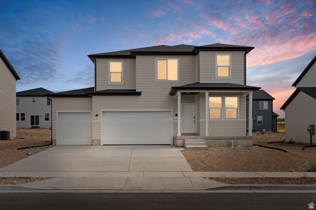 322 West 600 North, Unit 47 Tooele, UT 84074 - Photo 1 of 1 **DISCLAIMER** Exterior color and elevation may vary. View of front facade featuring concrete driveway, an attached garage, and a shingled roof