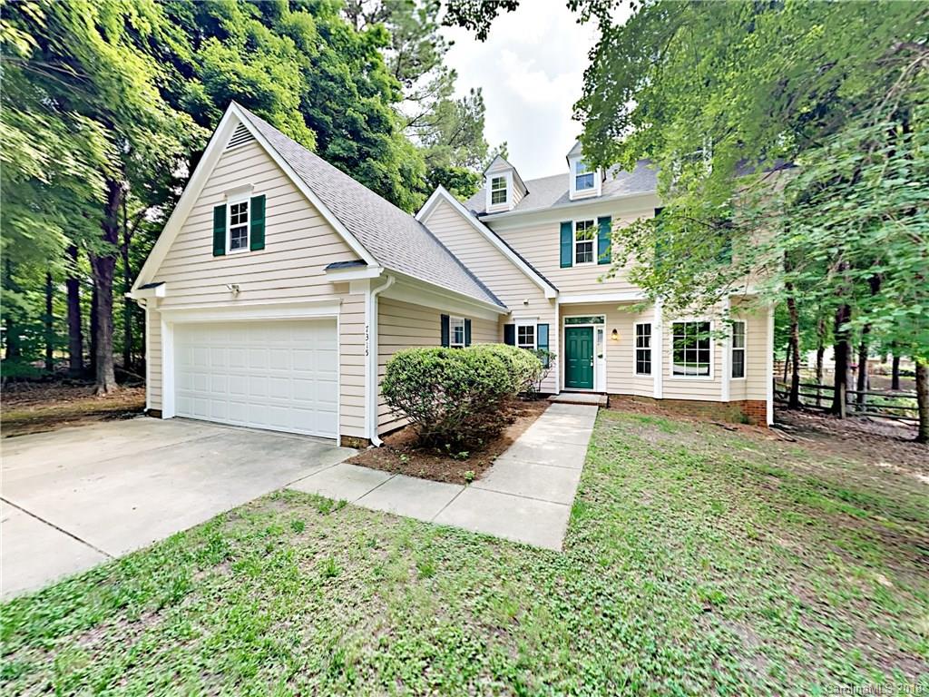 7315 Reedy Creek Road Charlotte, NC 28215 - Photo 1 of 18 a front view of a house with a yard