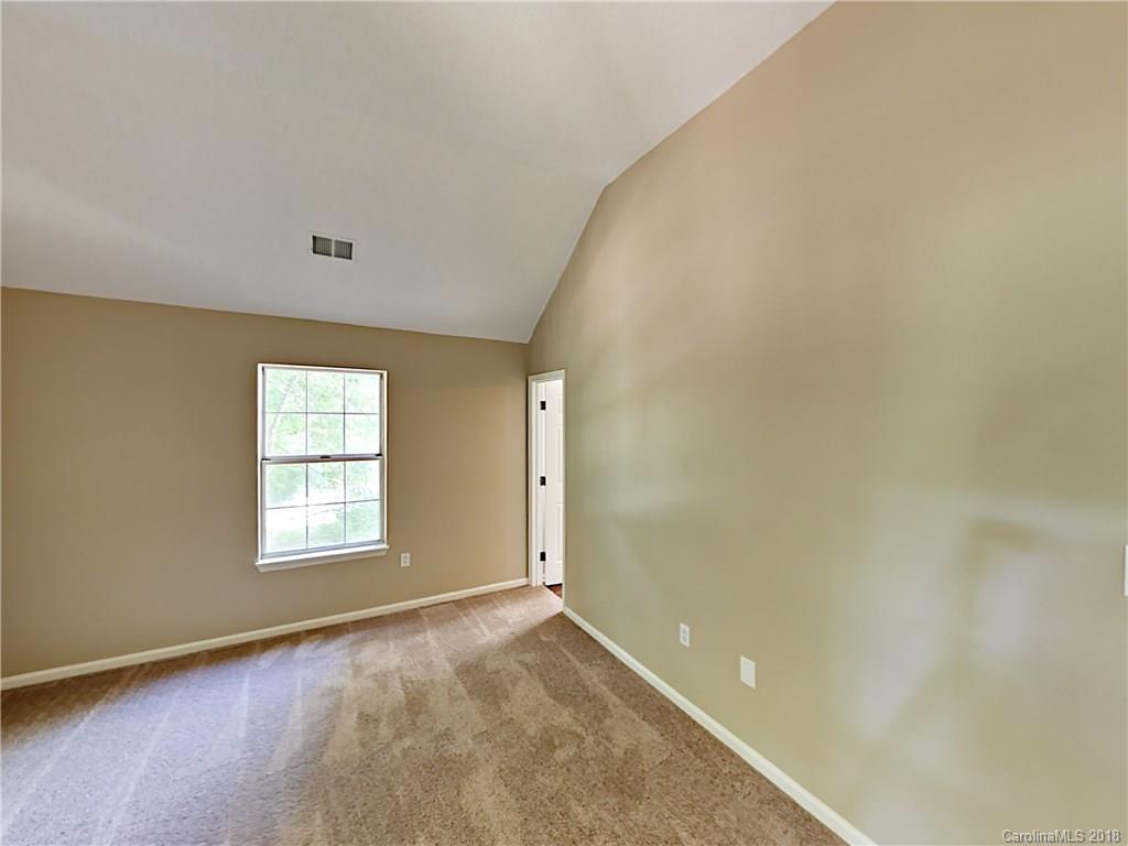 7315 Reedy Creek Road Charlotte, NC 28215 - Photo 11 of 18 an empty room with windows