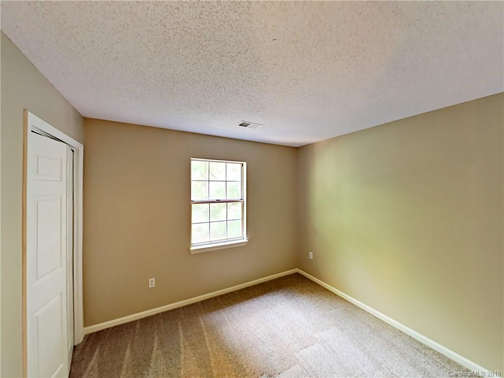 7315 Reedy Creek Road Charlotte, NC 28215 - Photo 14 of 18 an empty room with a window