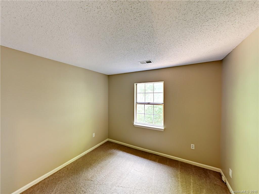 7315 Reedy Creek Road Charlotte, NC 28215 - Photo 15 of 18 an empty room with a window
