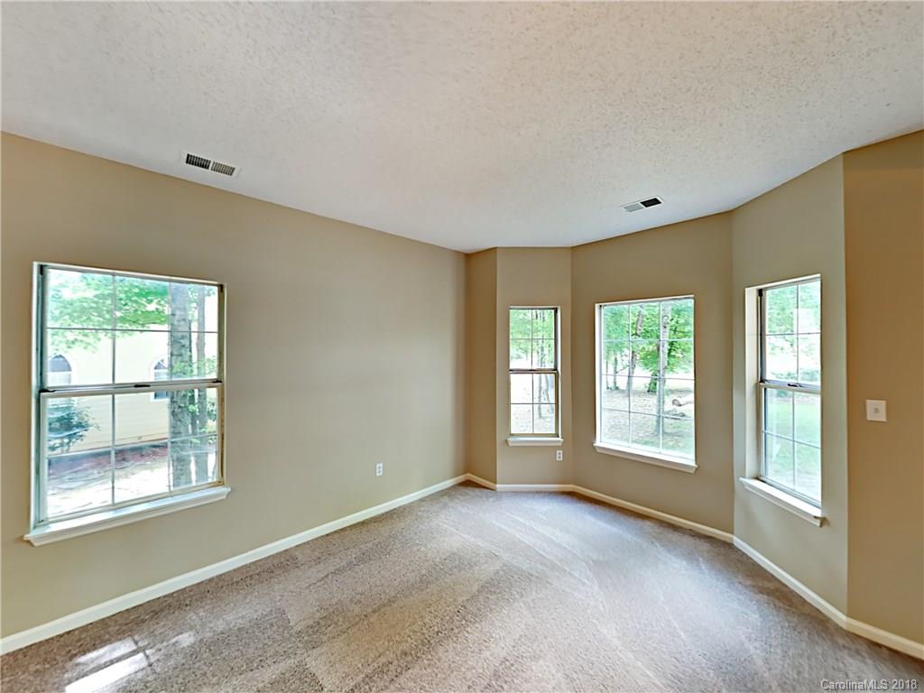 7315 Reedy Creek Road Charlotte, NC 28215 - Photo 3 of 18 a view of an empty room with a window