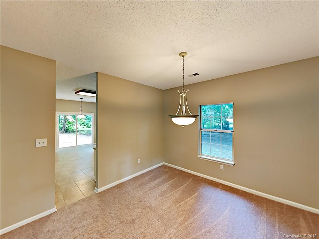 7315 Reedy Creek Road Charlotte, NC 28215 - Photo 5 of 18 an empty room with windows and closet