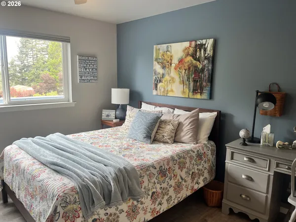 a bedroom with a bed and window