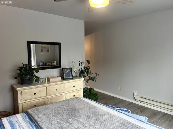 a bedroom with a bed and a dresser