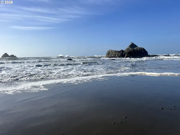 a view of a outdoor space with a car parked beside a road