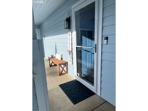 a roof deck with wooden floor and potted plants