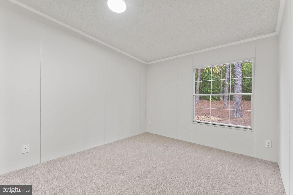 1109 Eastham Road Bumpass, VA 23024 - Photo 19 of 26 an empty room with a window