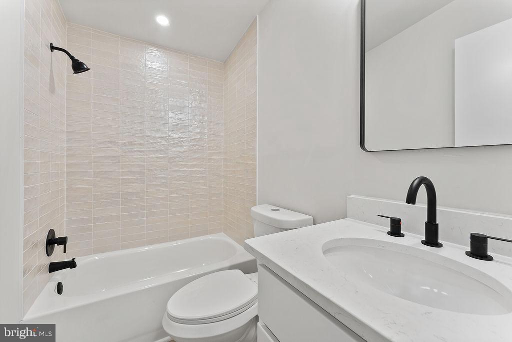 1109 Eastham Road Bumpass, VA 23024 - Photo 21 of 26 a bathroom with a sink toilet and shower