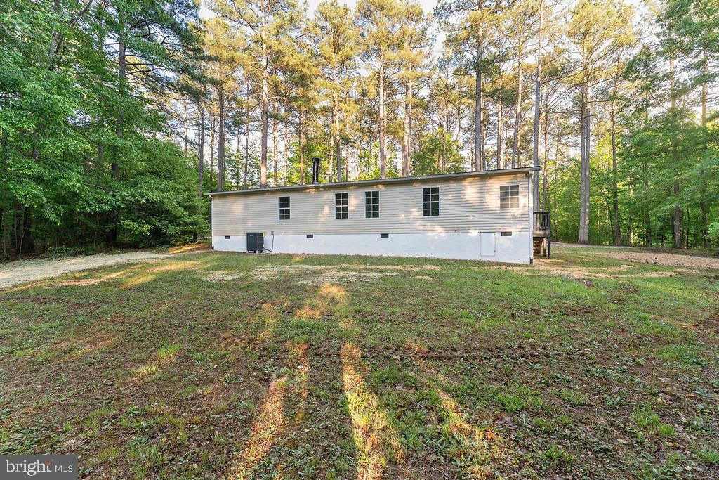 1109 Eastham Road Bumpass, VA 23024 - Photo 24 of 26 a house view with a sitting space and garden