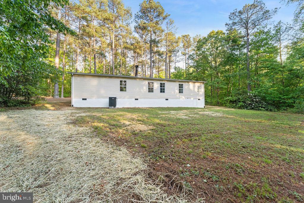 1109 Eastham Road Bumpass, VA 23024 - Photo 26 of 26 a view of a field with a tree