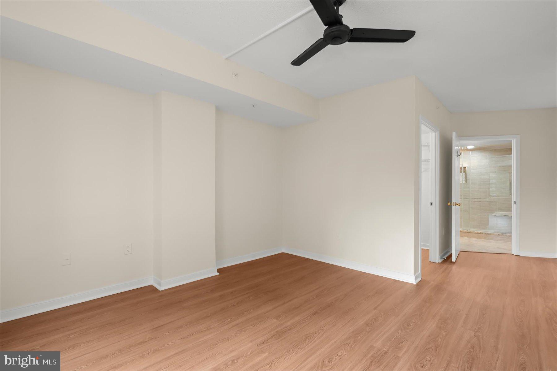 10001 Windstream Drive, Unit 404 Columbia, MD 21044 - Photo 26 of 51 a view of a big room with wooden floor and windows in a room