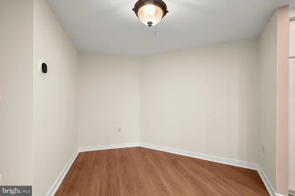 a view of a small space with wooden floor