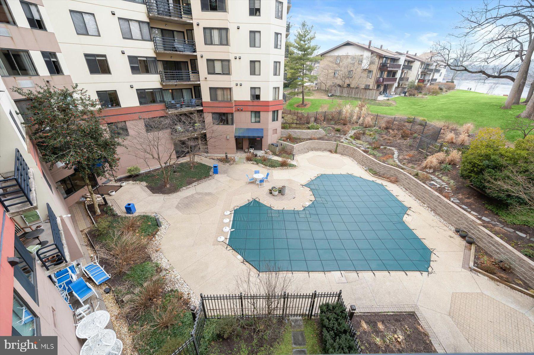 10001 Windstream Drive, Unit 404 Columbia, MD 21044 - Photo 43 of 51 a view of swimming pool with outdoor seating and plants
