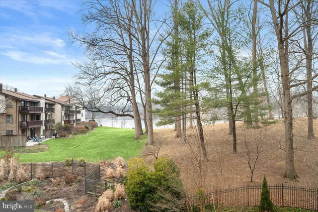 a view of a building with snow on the road