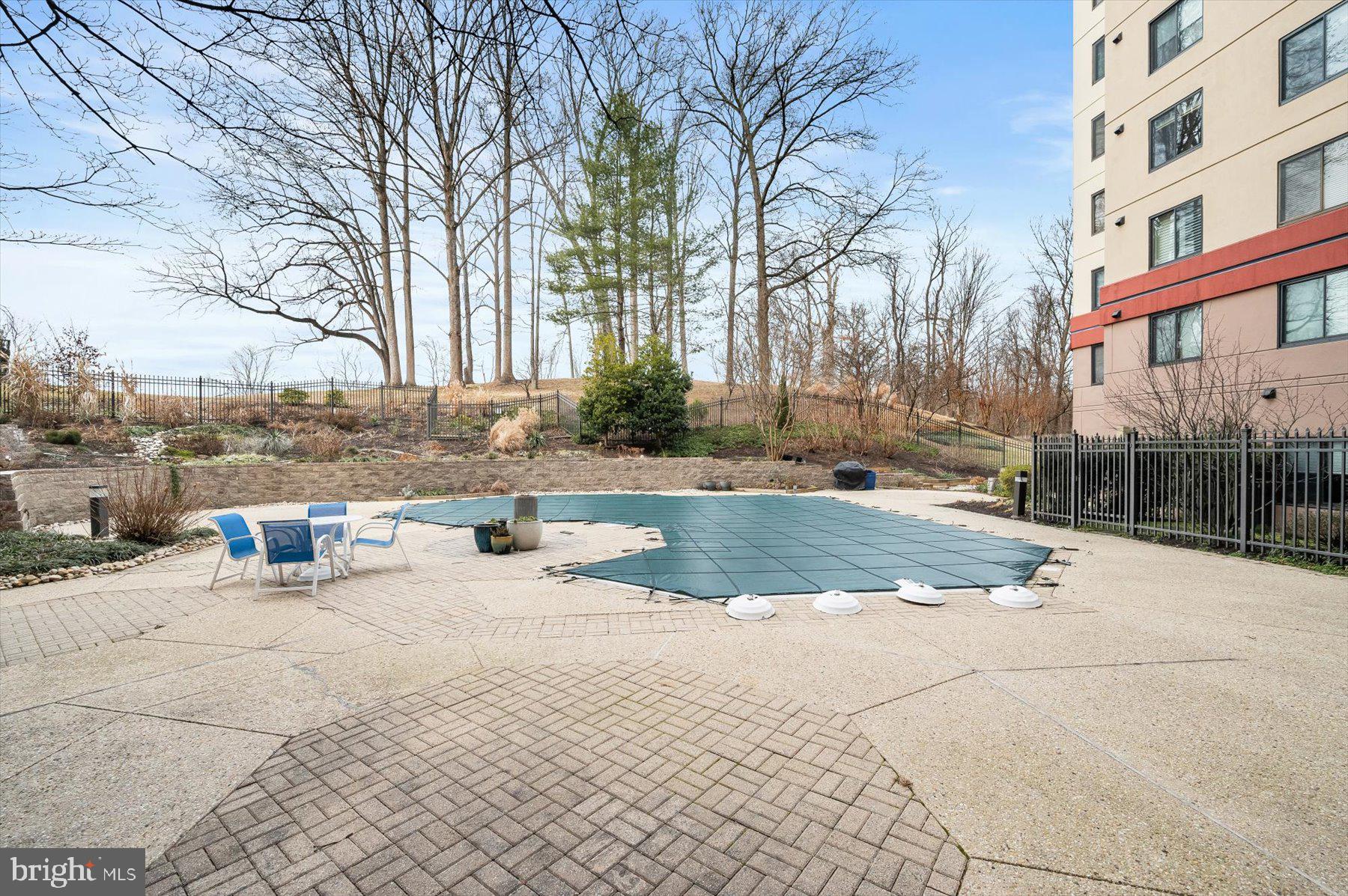 10001 Windstream Drive, Unit 404 Columbia, MD 21044 - Photo 46 of 51 a view of a building with snow on the road