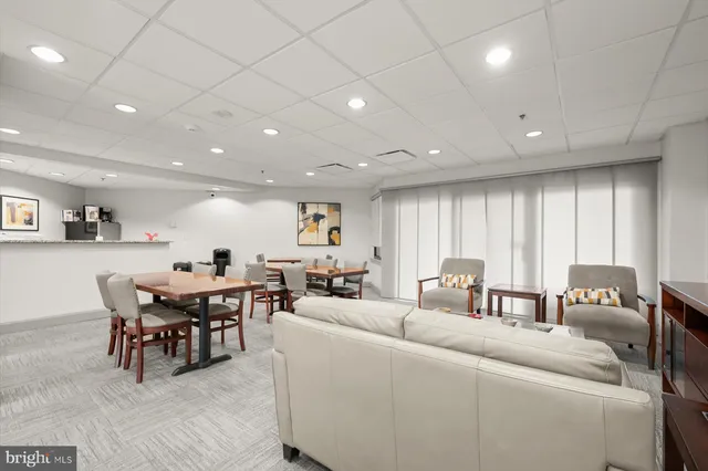 a picture of floor with lots of frames on wall