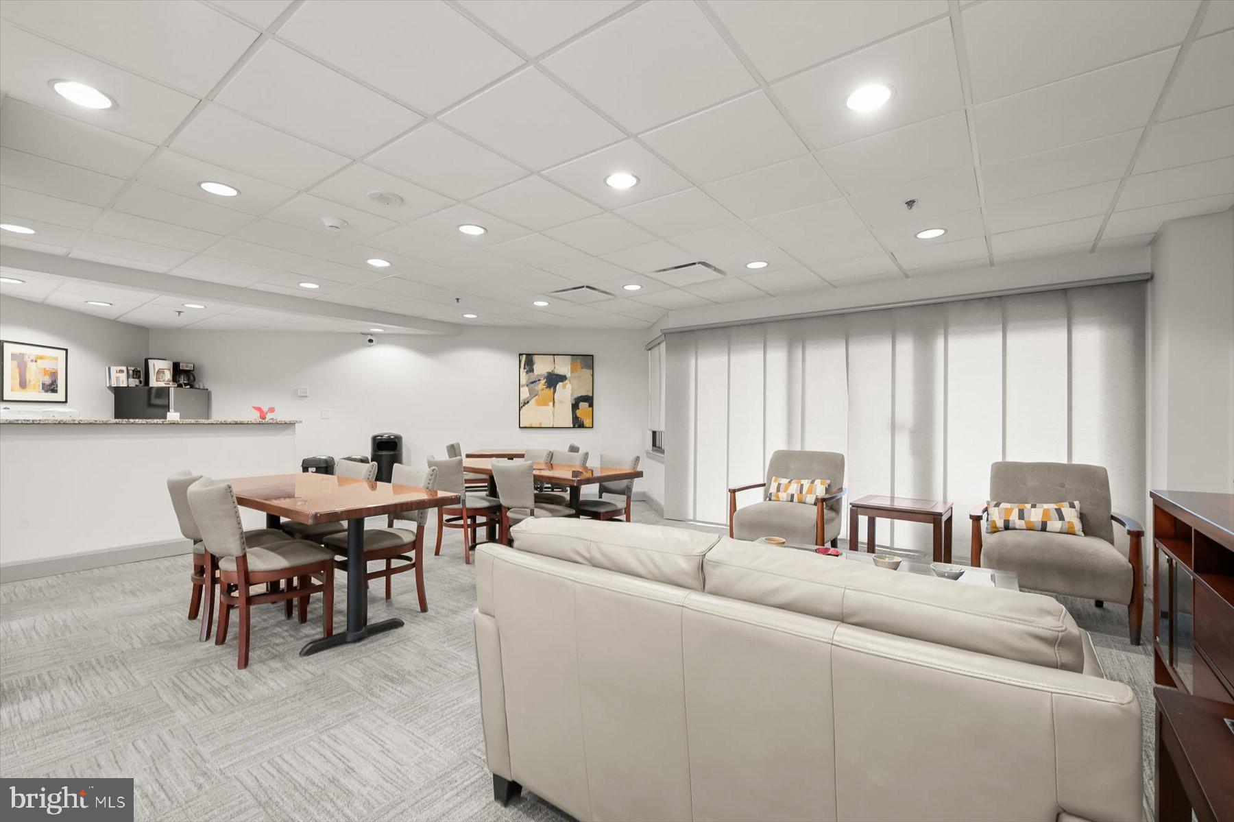 10001 Windstream Drive, Unit 404 Columbia, MD 21044 - Photo 50 of 51 a living room with furniture and a large window