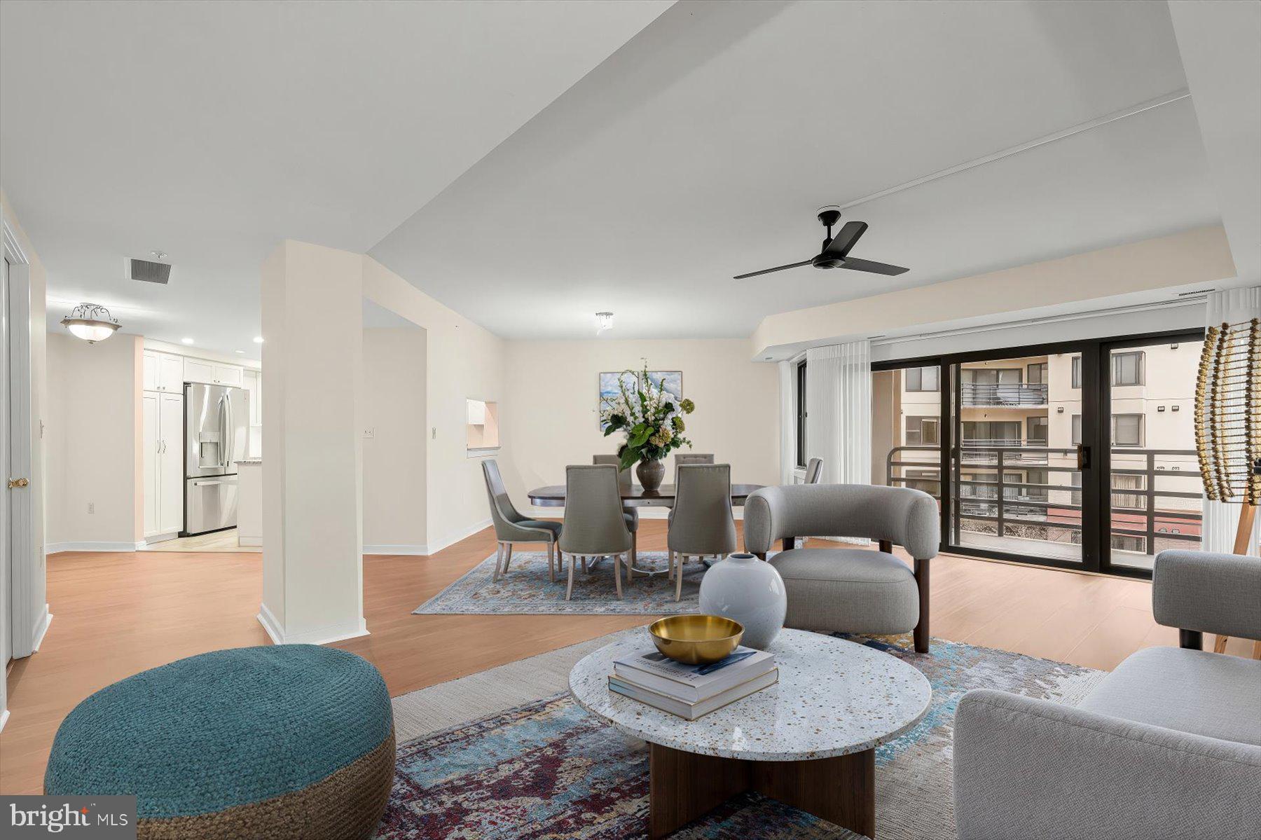 10001 Windstream Drive, Unit 404 Columbia, MD 21044 - Photo 5 of 51 a living room with furniture and a wooden floor