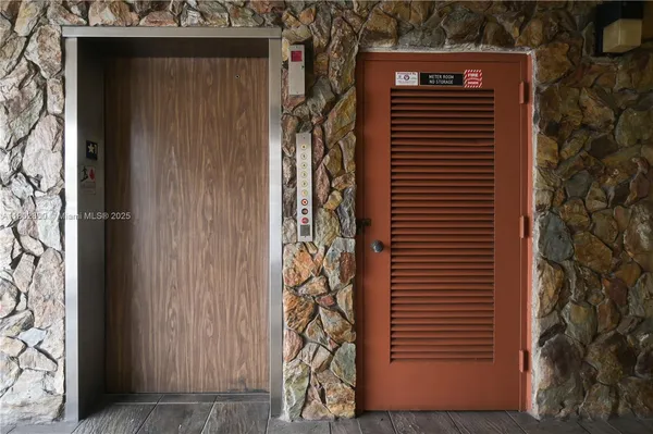 a view of a patio with a table and chairs