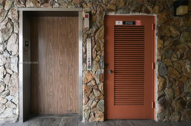 a view of a patio with a table and chairs