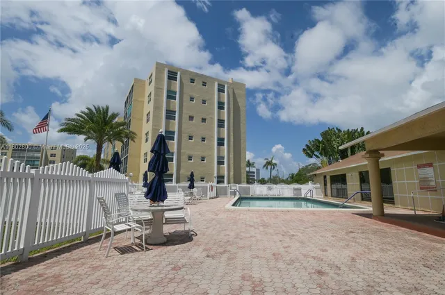 a living room with lots of furniture and a view of living room