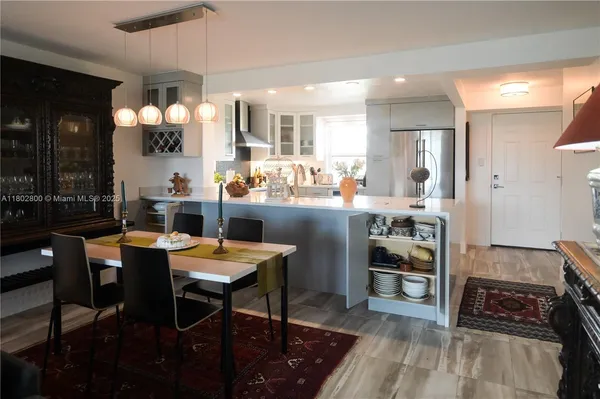 a kitchen with a table and chairs in it