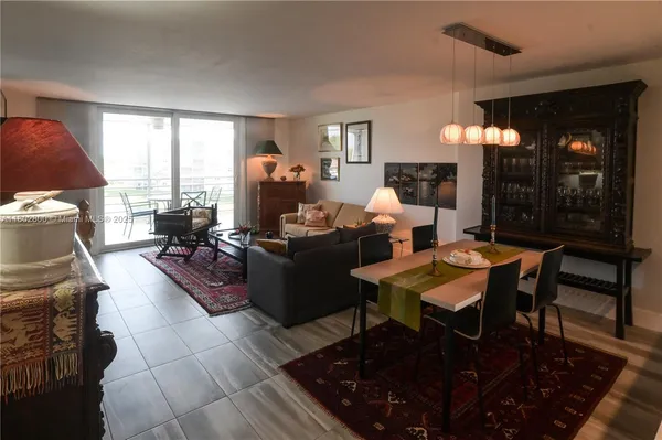 a living room with furniture a lamp and a fireplace