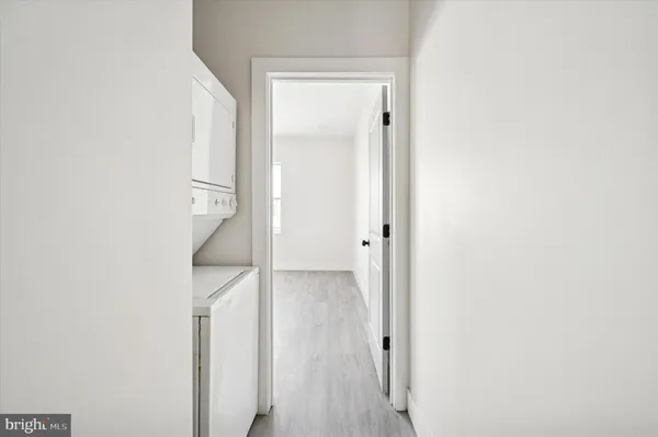 a view of hallway with wooden floor