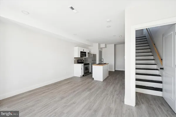 a view of kitchen with wooden floor