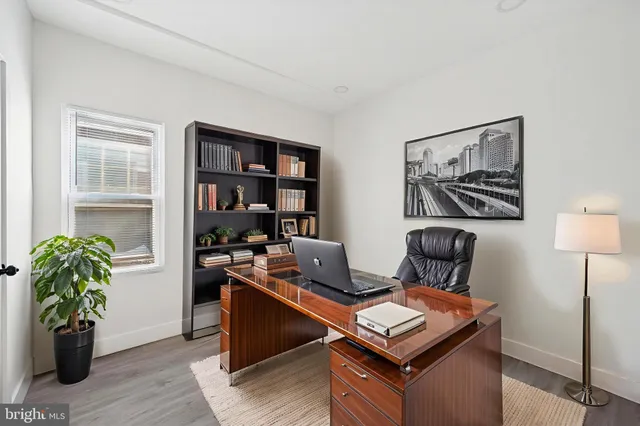 a workspace with furniture and wooden floor