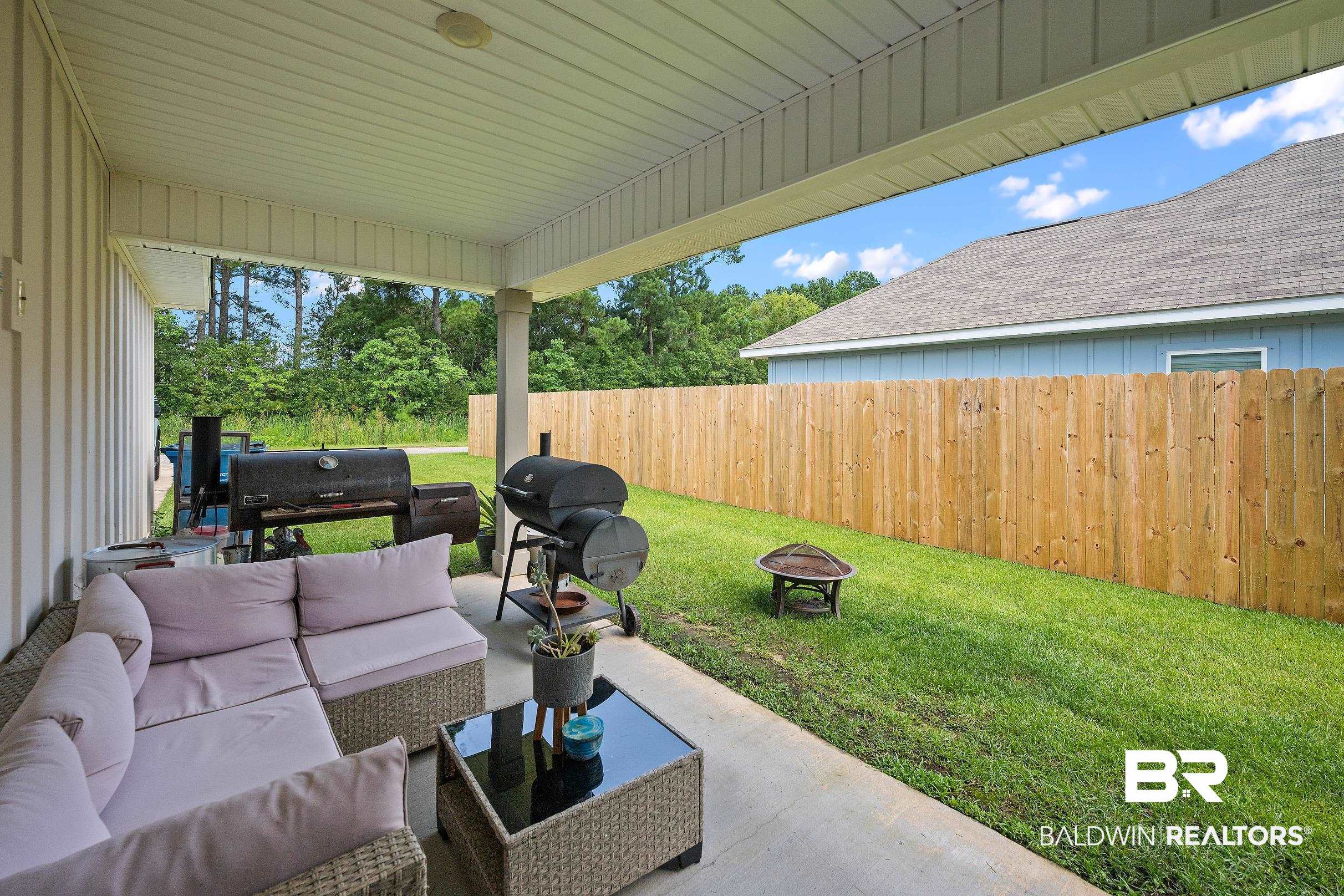 23997 Veranda Circle Elberta, AL 36530 - Photo 23 of 28 Covered concrete patio with recessed lighting, offering an outdoor living space