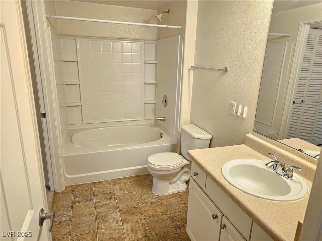 9000 South Las Vegas Boulevard, Unit 1176 Las Vegas, NV 89123 - Photo 13 of 26 Bathroom featuring a textured wall, vanity, and bathtub / shower combination