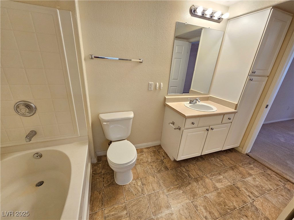 9000 South Las Vegas Boulevard, Unit 1176 Las Vegas, NV 89123 - Photo 15 of 26 Bathroom with a textured wall, vanity, and shower / bathtub combination