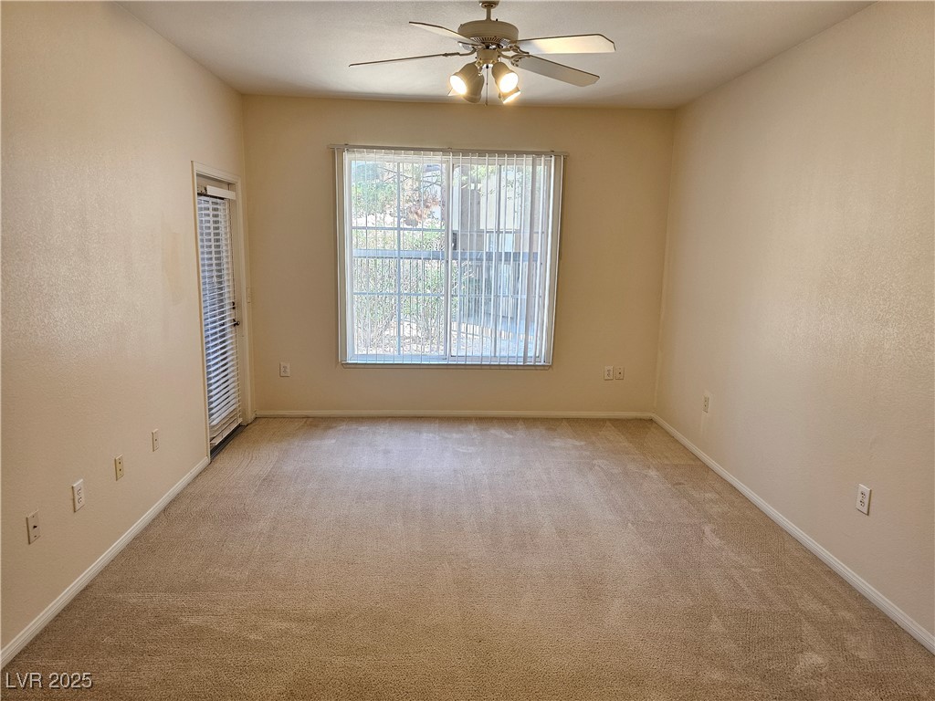 9000 South Las Vegas Boulevard, Unit 1176 Las Vegas, NV 89123 - Photo 19 of 26 Unfurnished room with light colored carpet, a textured wall, and ceiling fan