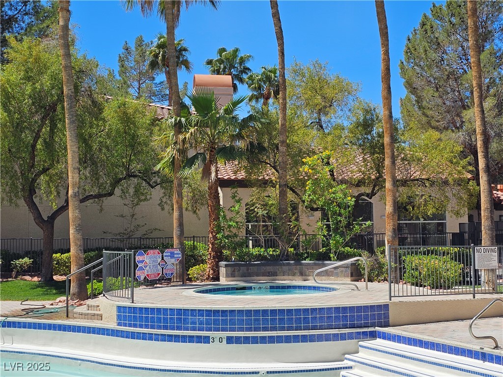 9000 South Las Vegas Boulevard, Unit 1176 Las Vegas, NV 89123 - Photo 24 of 26 View of swimming pool featuring a community hot tub, a patio, and a swimming pool