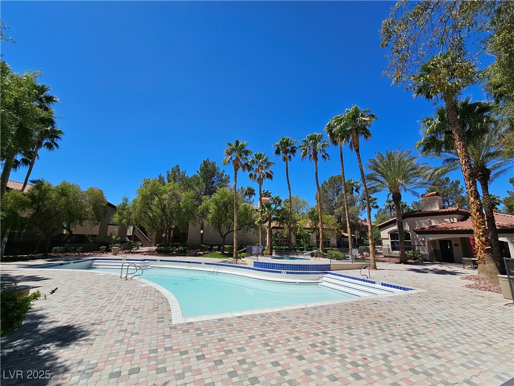 9000 South Las Vegas Boulevard, Unit 1176 Las Vegas, NV 89123 - Photo 4 of 26 Community pool featuring a hot tub and a patio