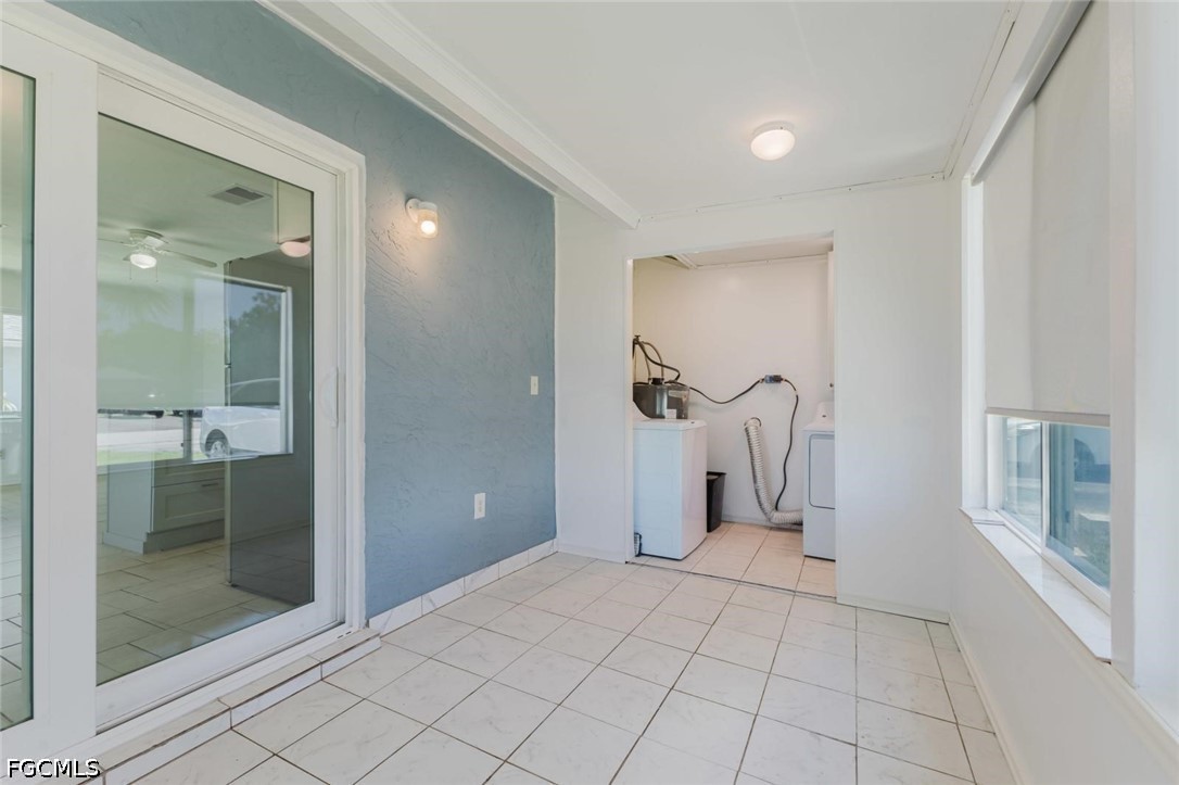 16595 Davis Road Fort Myers, FL 33908 - Photo 25 of 31 wooden floor with a bathroom and a mirror