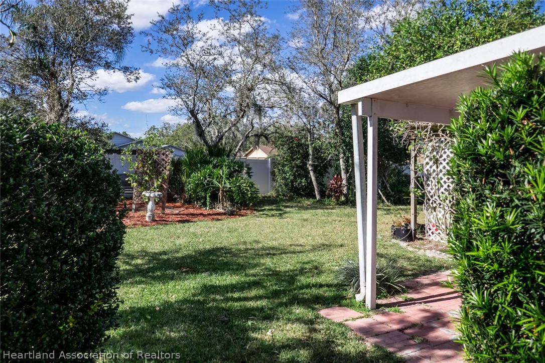 4115 Loquat Road Sebring, FL 33875 - Photo 15 of 28 a view of backyard with green space