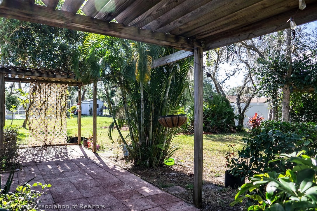 4115 Loquat Road Sebring, FL 33875 - Photo 21 of 28 a view of a porch with garden