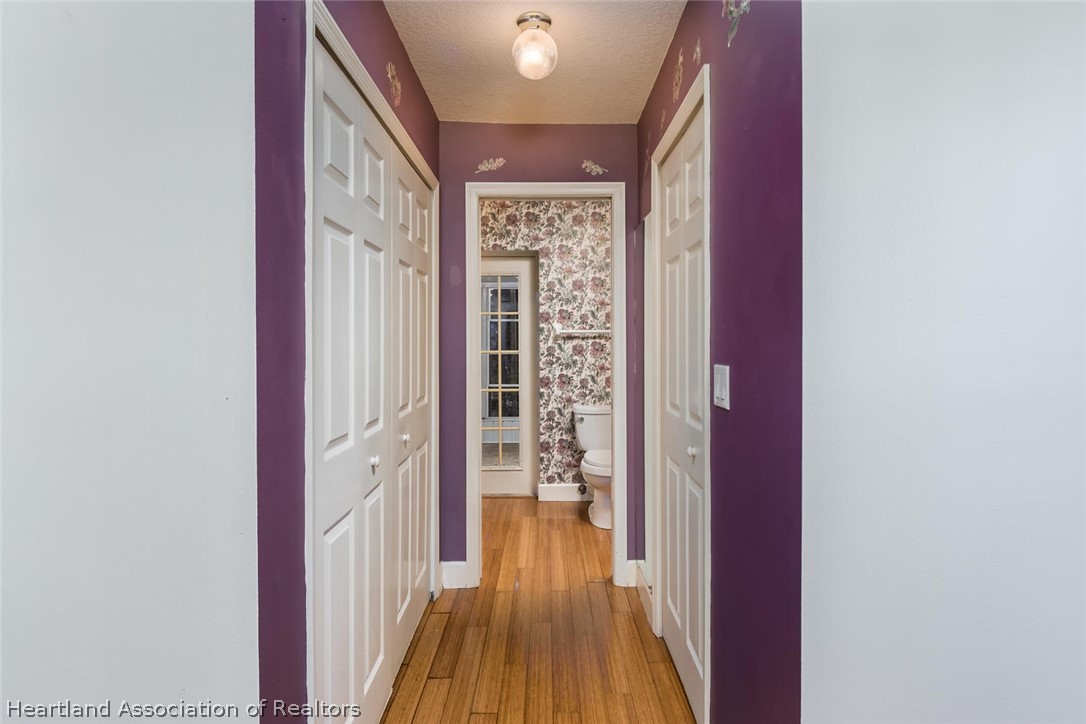 4115 Loquat Road Sebring, FL 33875 - Photo 8 of 28 a view of a hallway with wooden floor and windows