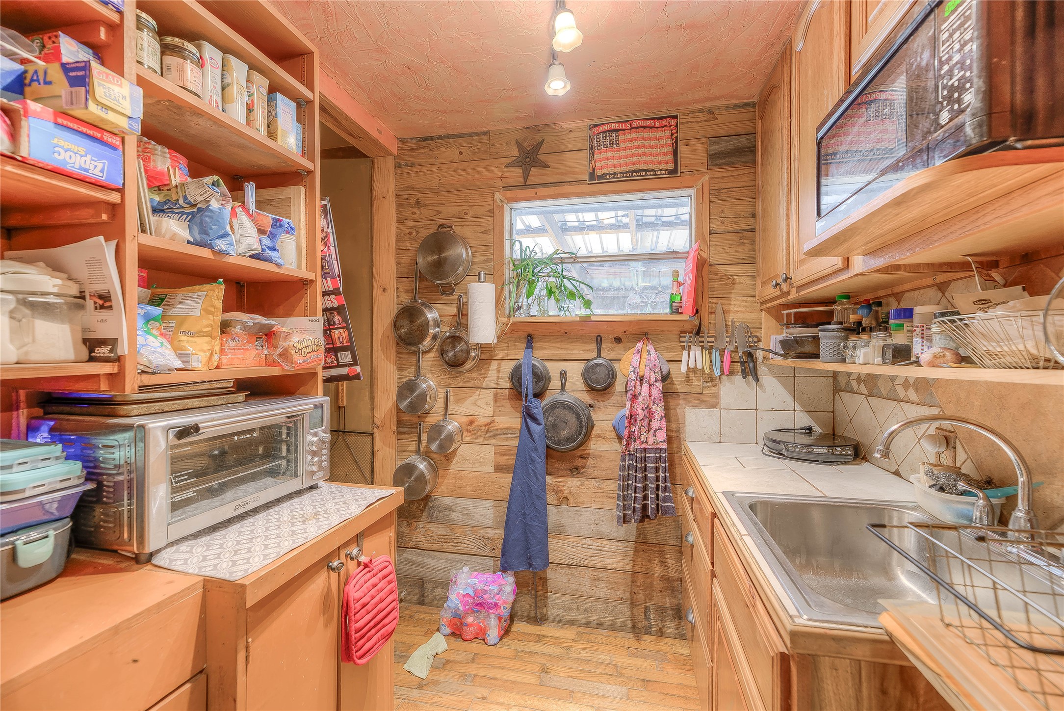300 L Green Road Cleveland, TX 77328 - Photo 11 of 44 a kitchen with stainless steel appliances kitchen island granite countertop a stove and a sink