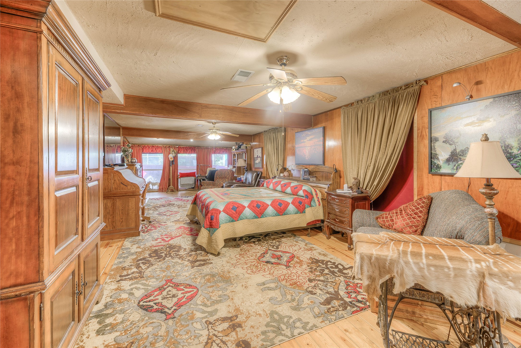 300 L Green Road Cleveland, TX 77328 - Photo 13 of 44 a bedroom with furniture and a chandelier