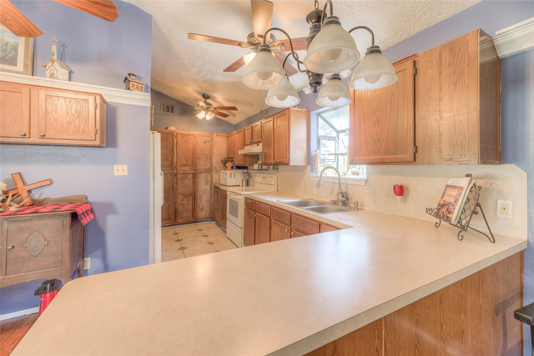 300 L Green Road Cleveland, TX 77328 - Photo 18 of 44 a view of a kitchen with a sink and chandelier