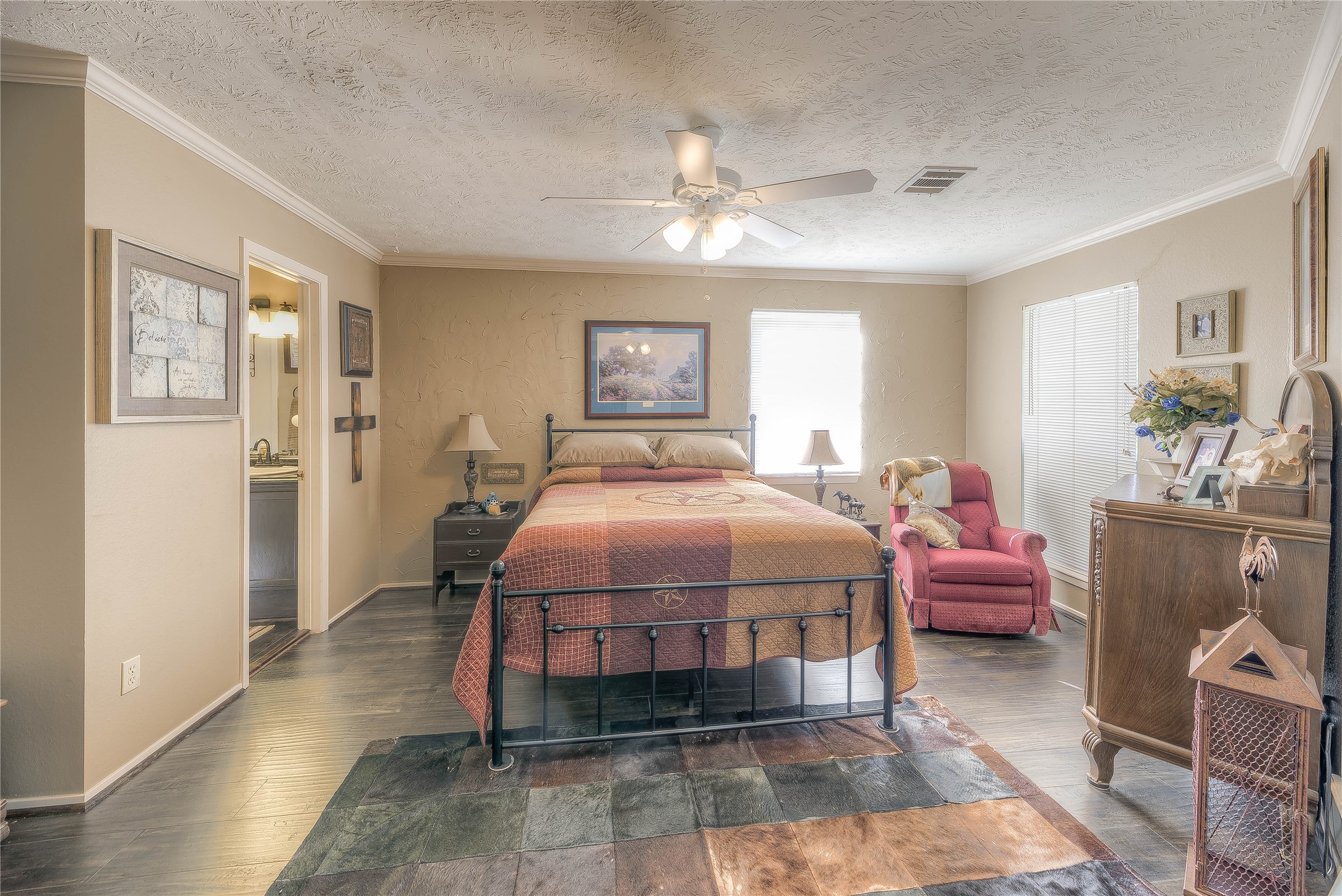 300 L Green Road Cleveland, TX 77328 - Photo 21 of 44 a bedroom with a bed and wooden floor